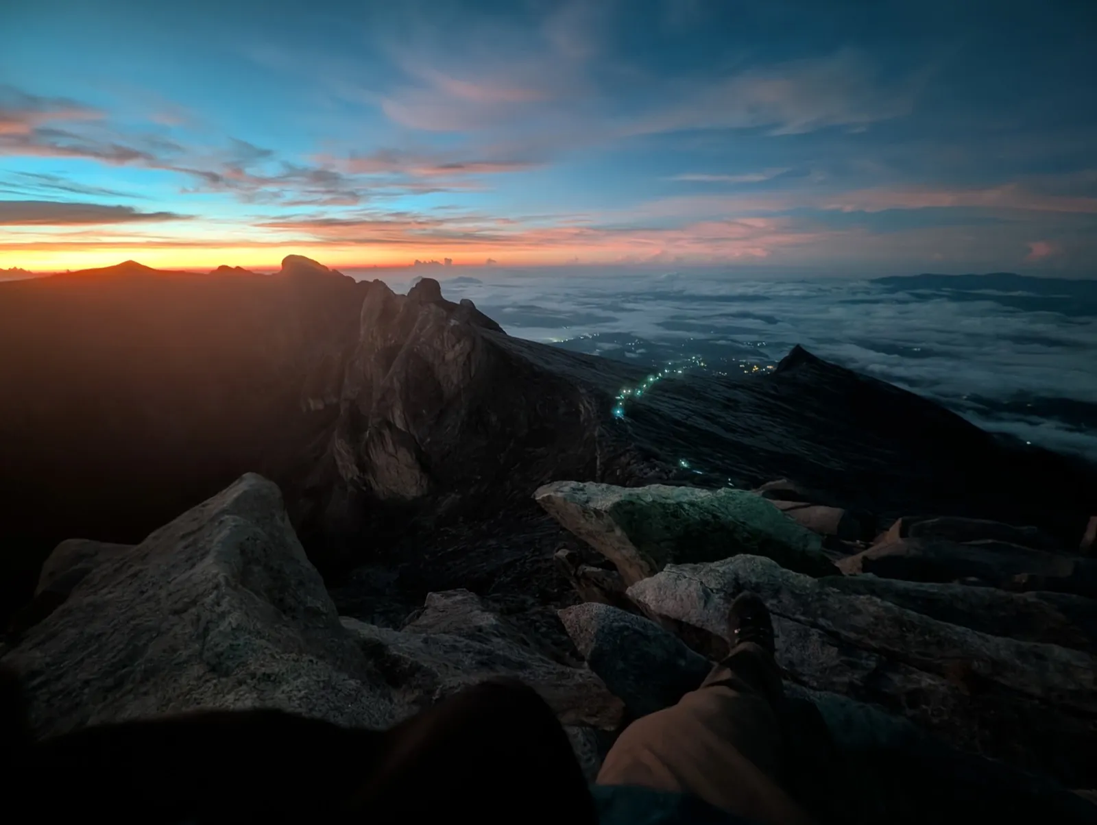 Waiting for sunrise at the summit; headlamps still visible below