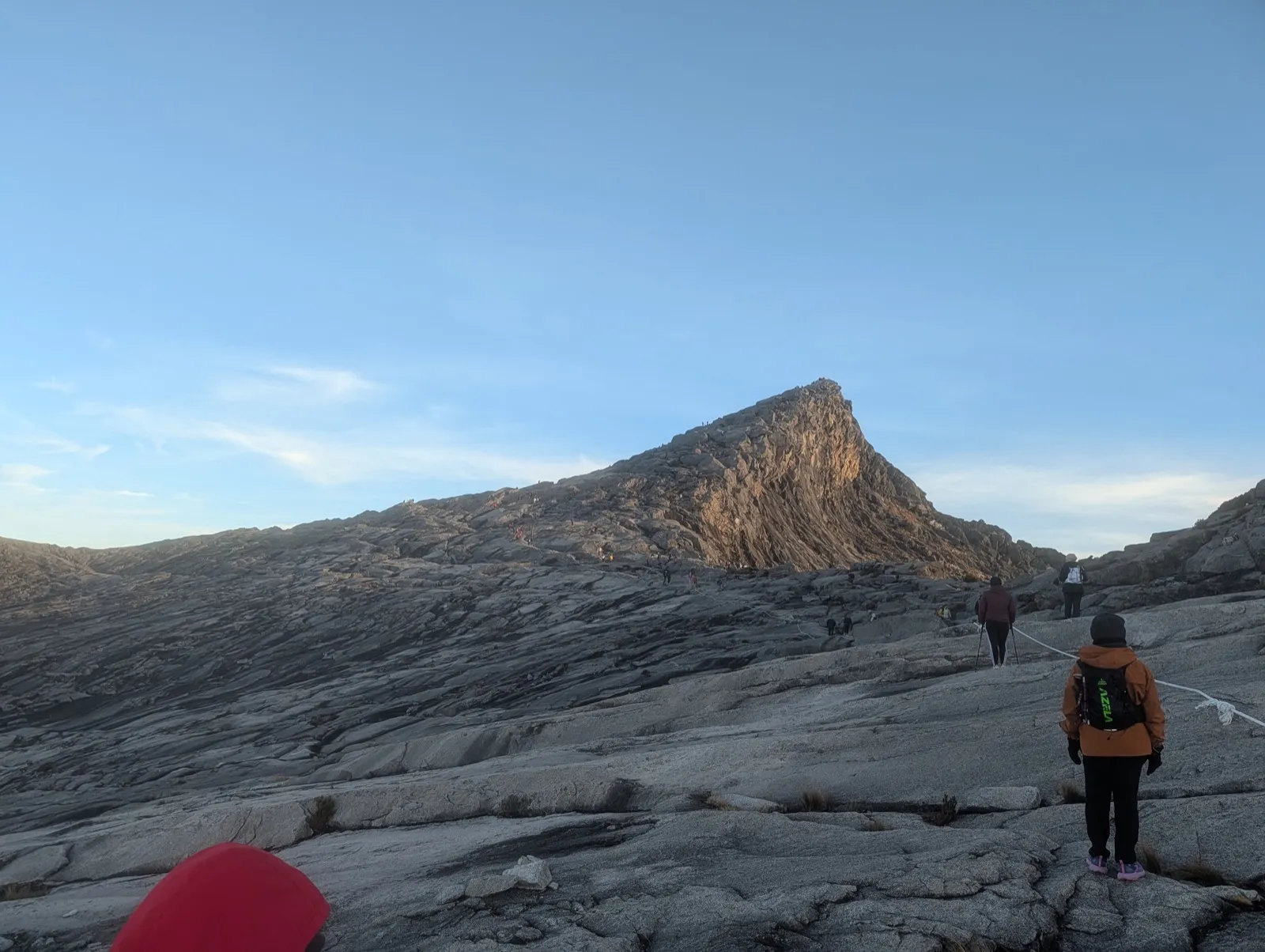 Low's Peak (4,095m) in the morning; climbers reaching the top via the fixed rope